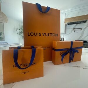 2 Louis Vuitton orange bags and 1 Louis Vuitton box with ribbon and tissue paper